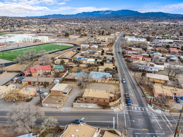 birds eye view of property with a mountain view
