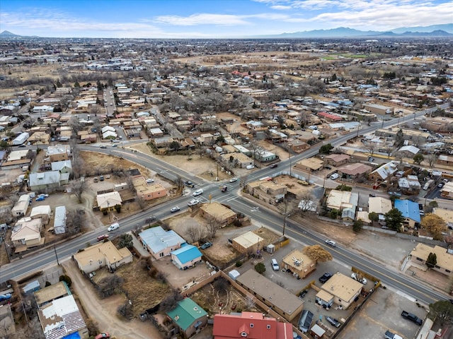 drone / aerial view featuring a residential view and a mountain view