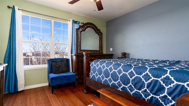 bedroom with wood-type flooring and ceiling fan