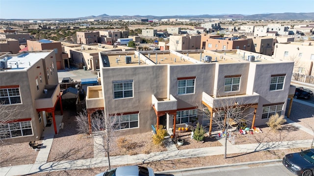 birds eye view of property featuring a mountain view