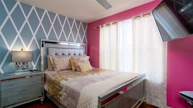 bedroom with ceiling fan and dark hardwood / wood-style floors