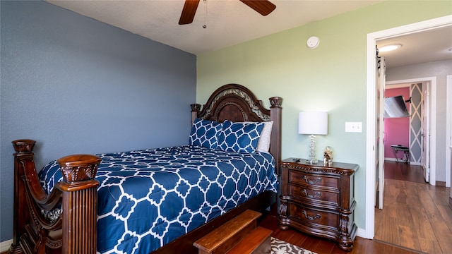 bedroom featuring hardwood / wood-style floors and ceiling fan