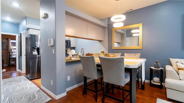 dining space featuring hardwood / wood-style floors