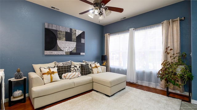 living room with hardwood / wood-style flooring and ceiling fan