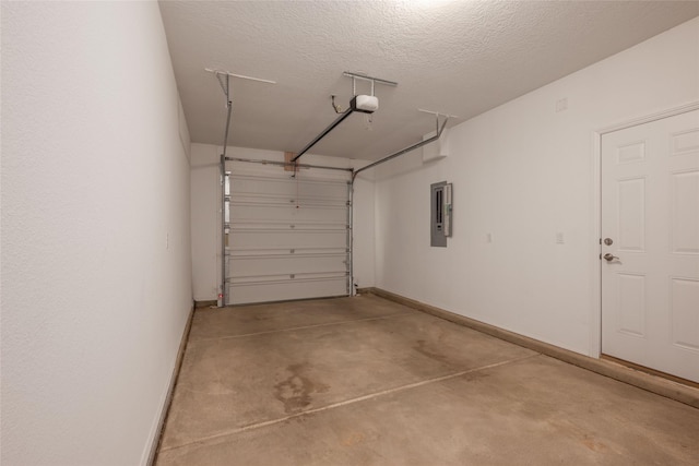 garage with a garage door opener and electric panel