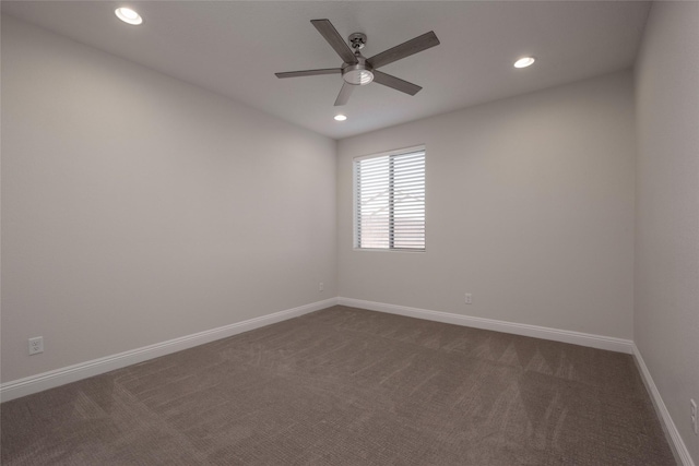 carpeted empty room featuring ceiling fan