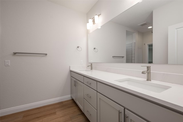 bathroom featuring hardwood / wood-style flooring and vanity