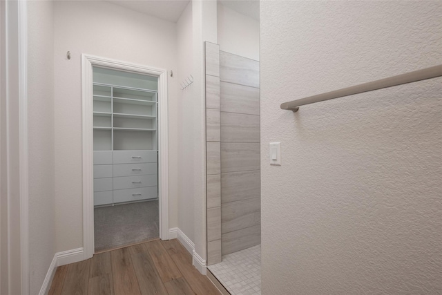 hallway with light hardwood / wood-style flooring