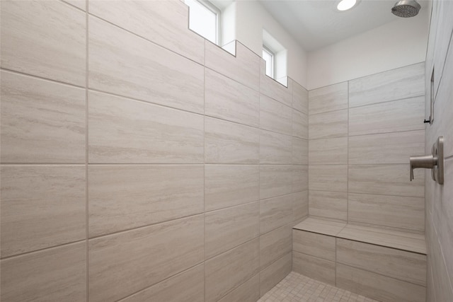 bathroom featuring tiled shower