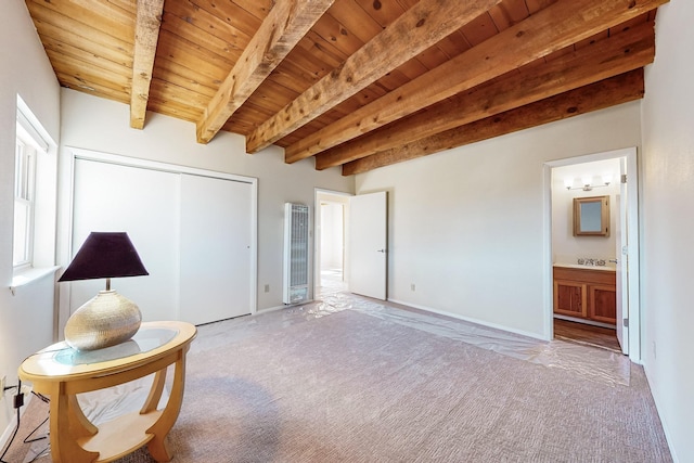 unfurnished room with light carpet, wooden ceiling, and beamed ceiling