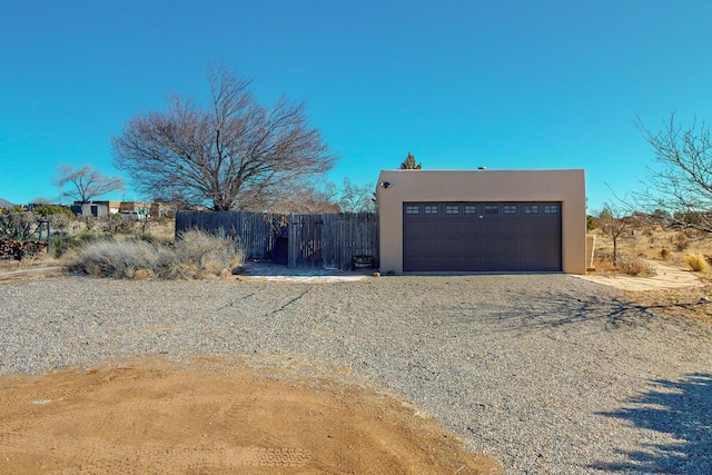 view of side of home with a garage