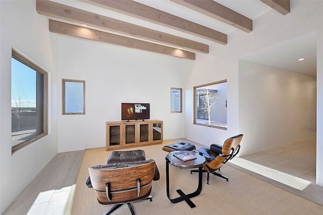 sitting room with beam ceiling