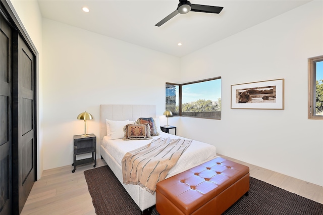 bedroom featuring a closet, ceiling fan, and light hardwood / wood-style flooring