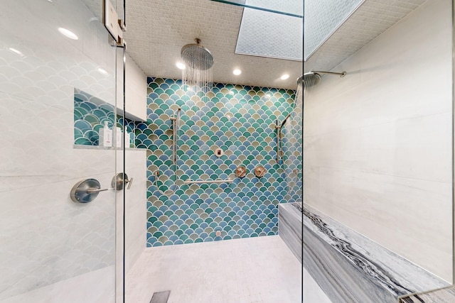 bathroom with tiled shower