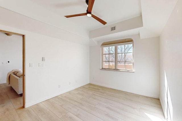 spare room with ceiling fan and light hardwood / wood-style floors