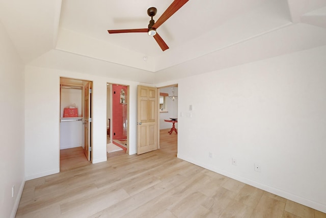 unfurnished bedroom with lofted ceiling, light hardwood / wood-style flooring, and ceiling fan