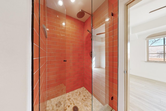 bathroom with tiled shower