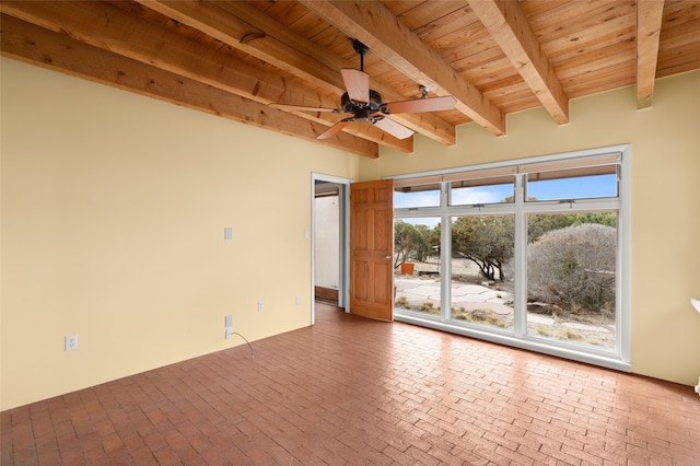 spare room with beam ceiling, wood ceiling, and ceiling fan