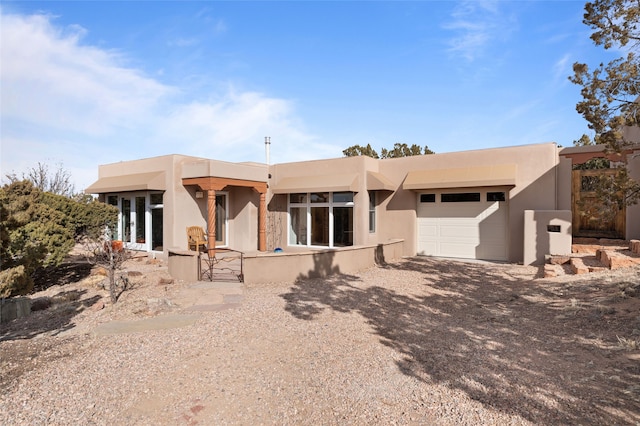 adobe home featuring a garage