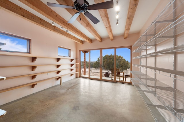 interior space with ceiling fan