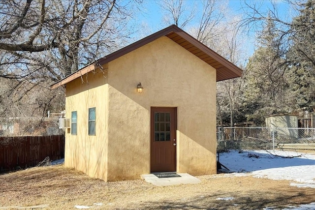 view of snow covered rear of property