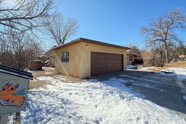 view of snow covered garage