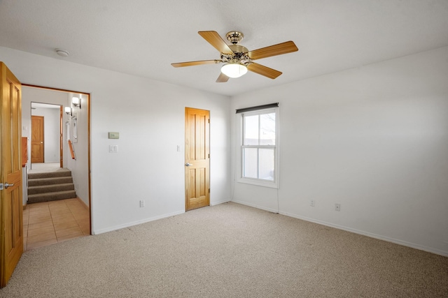 unfurnished bedroom with light carpet and ceiling fan