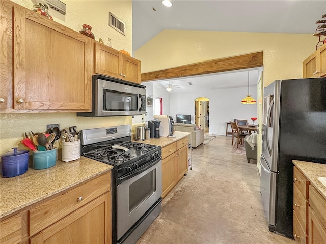 kitchen with hanging light fixtures, light stone countertops, appliances with stainless steel finishes, and lofted ceiling