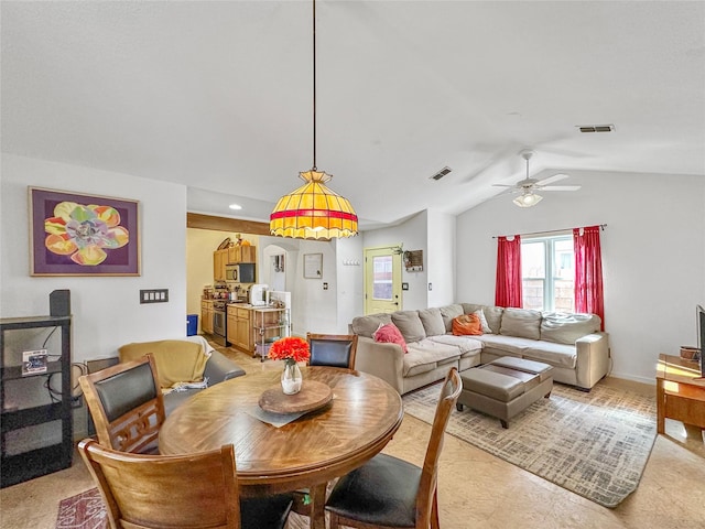 dining area with vaulted ceiling and ceiling fan