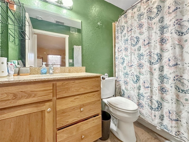 bathroom with vanity, toilet, and a shower with shower curtain