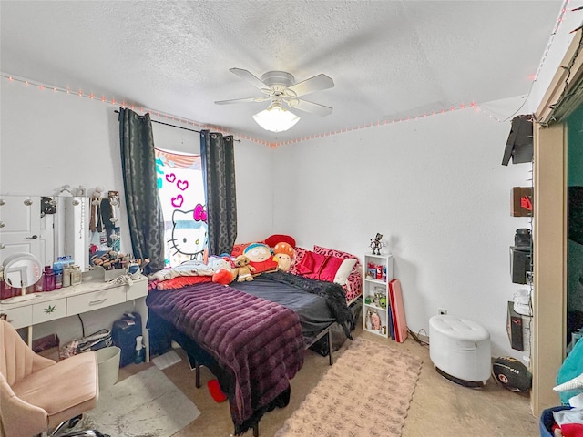 bedroom featuring ceiling fan and a textured ceiling