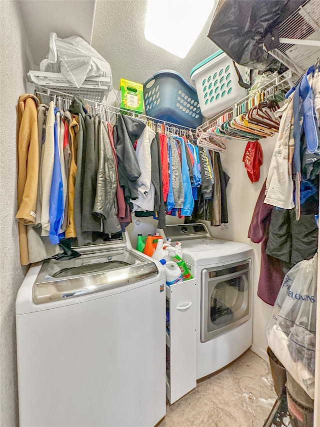 washroom featuring washer and clothes dryer