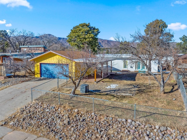 view of front of house with a mountain view and a garage