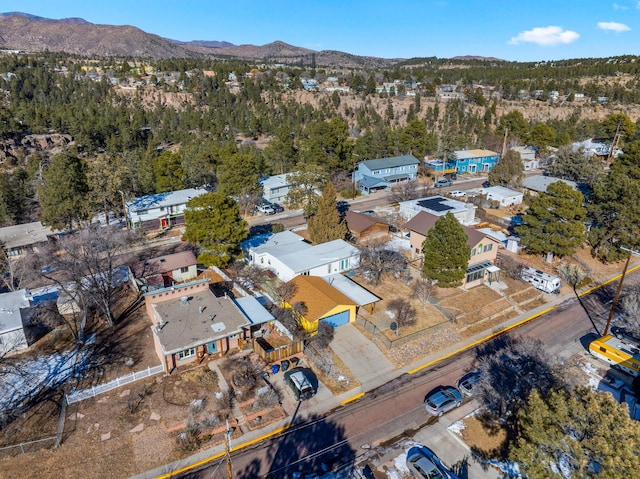 birds eye view of property with a mountain view