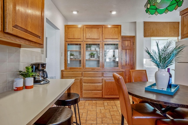 kitchen featuring a breakfast bar and decorative backsplash