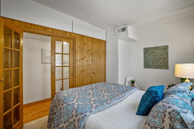 bedroom with wood-type flooring