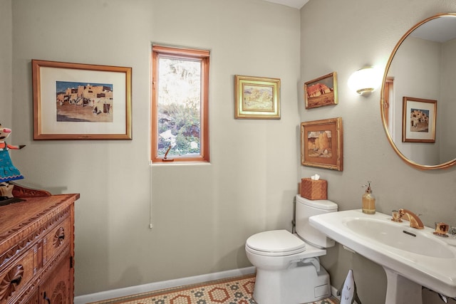 bathroom with sink and toilet