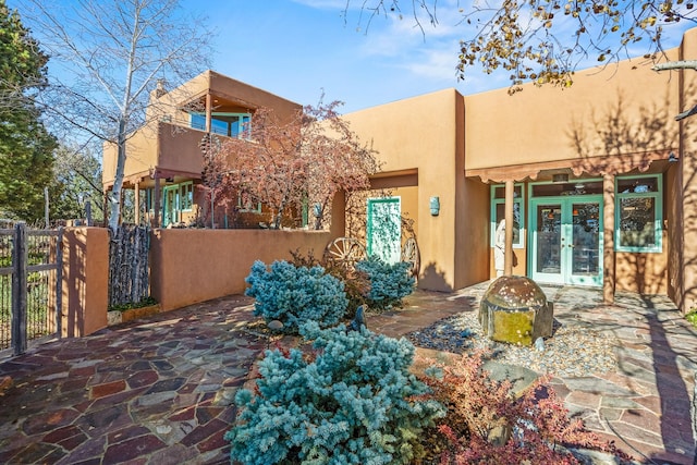 rear view of property with french doors