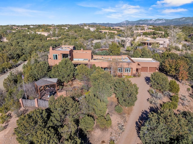 birds eye view of property with a mountain view