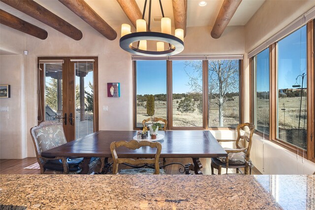 kitchen with sink, ventilation hood, light hardwood / wood-style flooring, stainless steel appliances, and light stone countertops