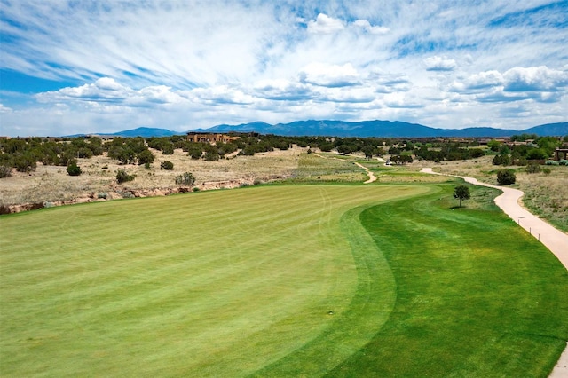 surrounding community featuring golf course view and a mountain view