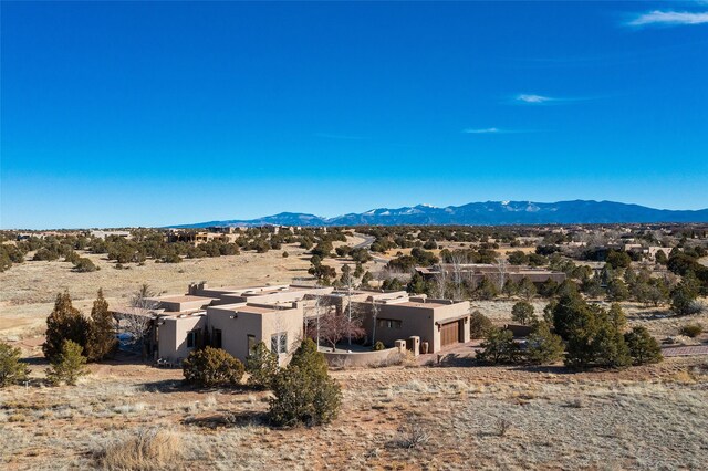 surrounding community featuring golf course view and a mountain view