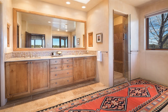 bathroom with vanity and an enclosed shower