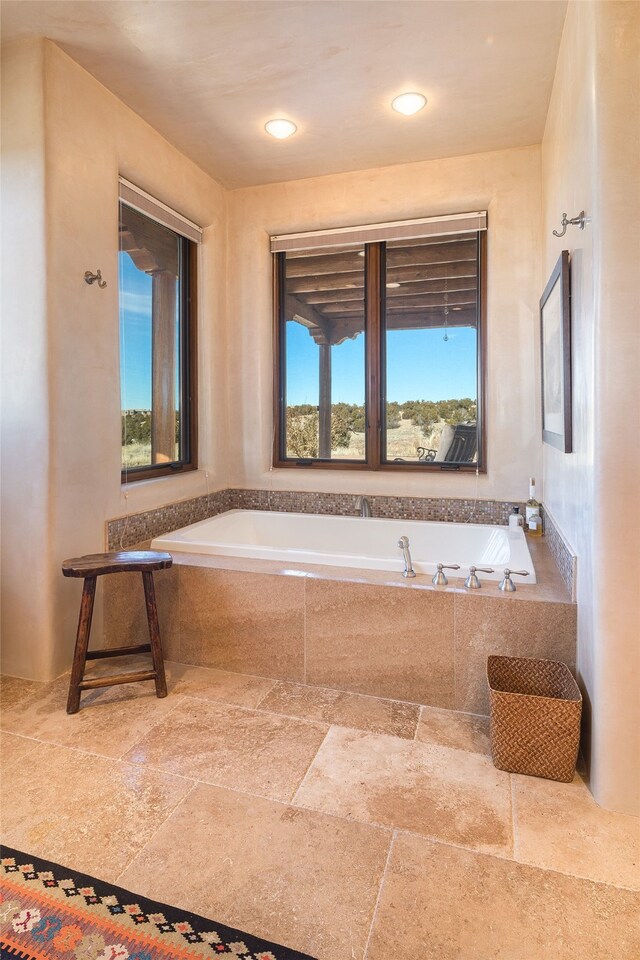 bathroom with a tile shower