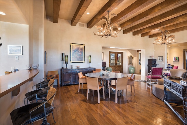 dining space with beamed ceiling, dark hardwood / wood-style floors, and a notable chandelier