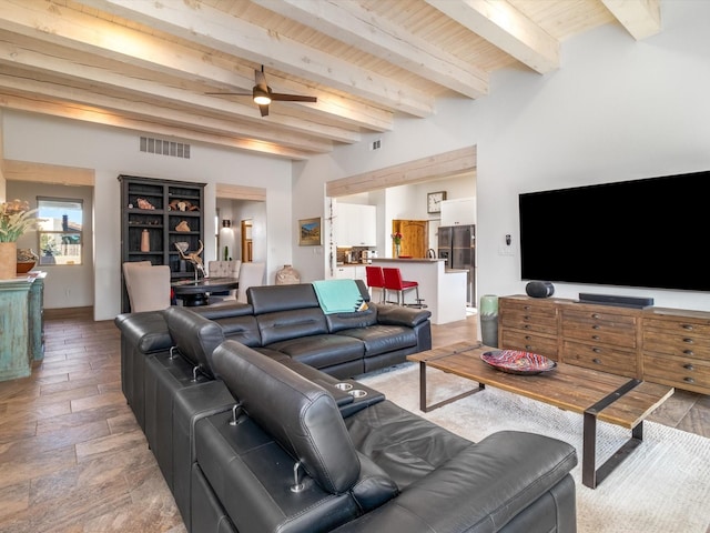 living room featuring beamed ceiling