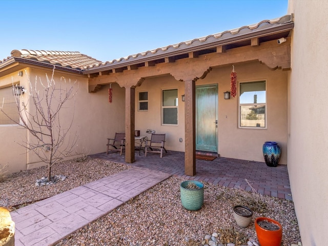 rear view of property featuring a patio area