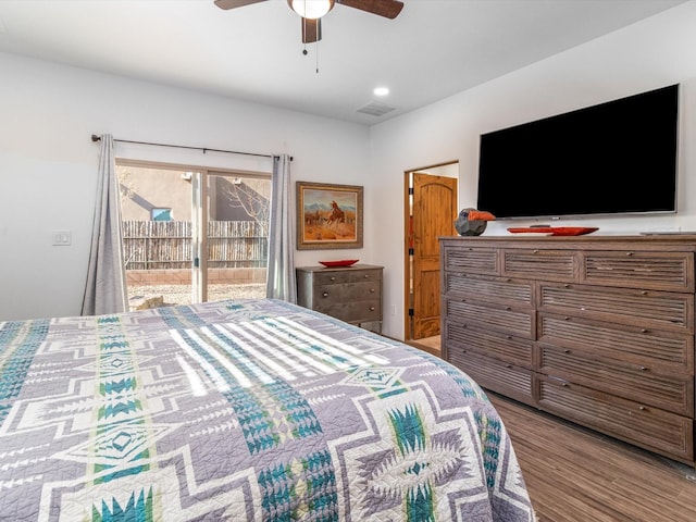 bedroom with hardwood / wood-style floors, access to outside, and ceiling fan