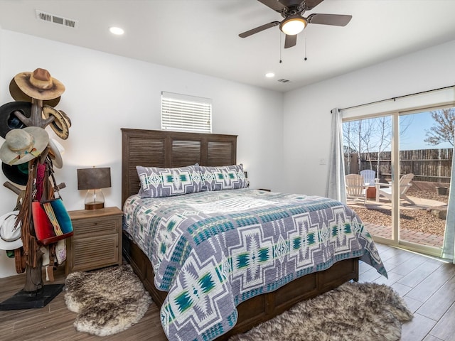 bedroom with wood-type flooring, access to exterior, and ceiling fan