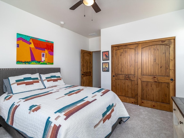 carpeted bedroom with ceiling fan